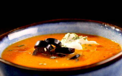 Sweet paprika soup with black olives