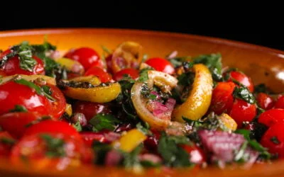 Tomato salad with slices of grilled lemon