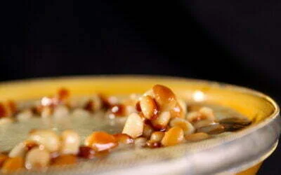 Cauliflower soup with cumin and pine nuts