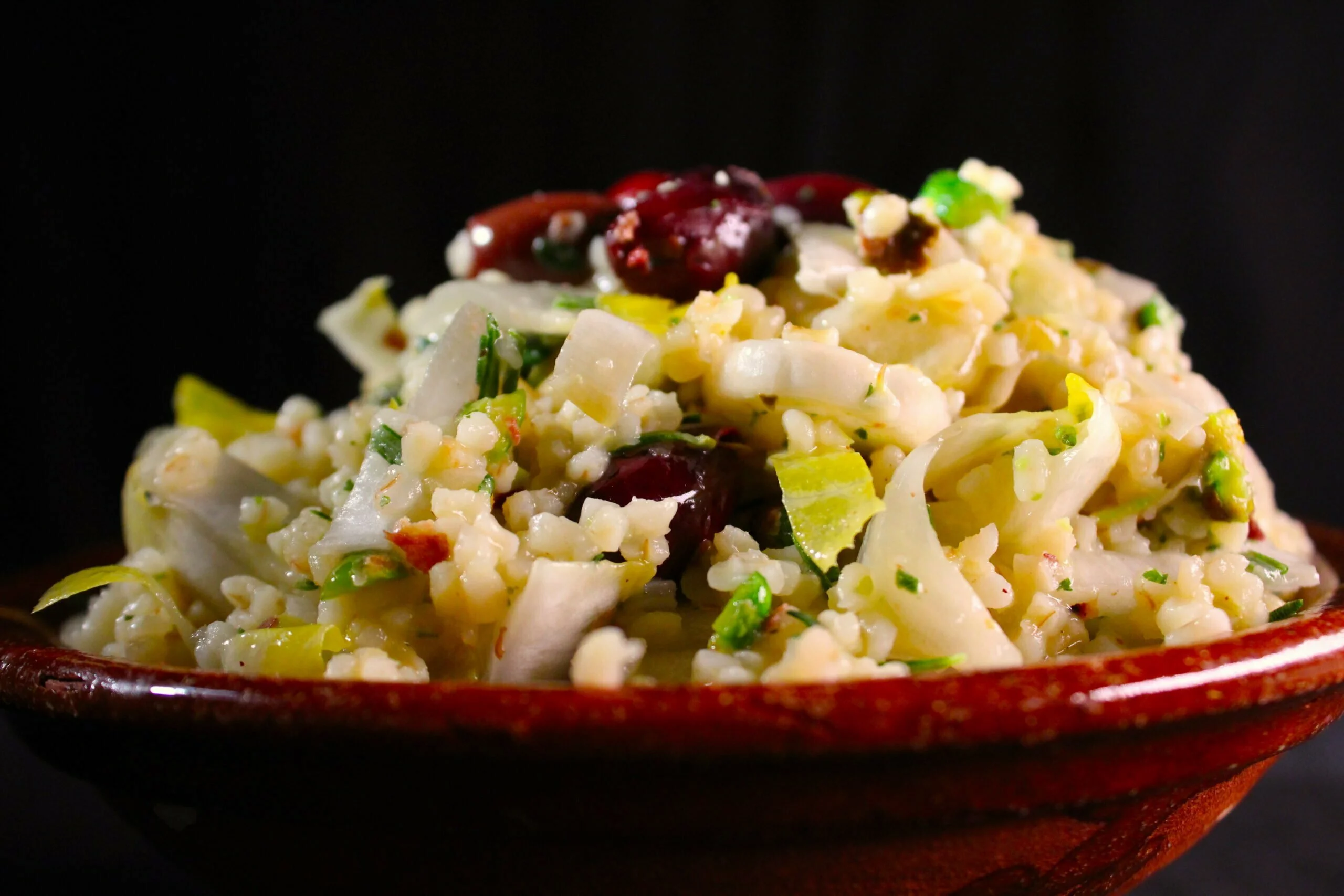 Bulgur chicory salad with kalamata olives and pistachio