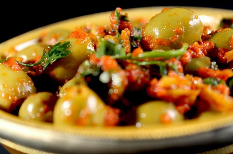 Spicy green olives in grilled peppers