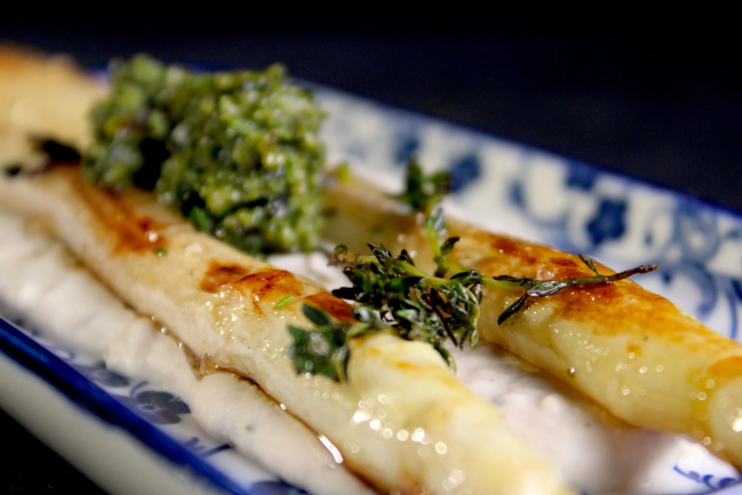 Asparagus on a bed of lima bean puree and with hazelnut pesto