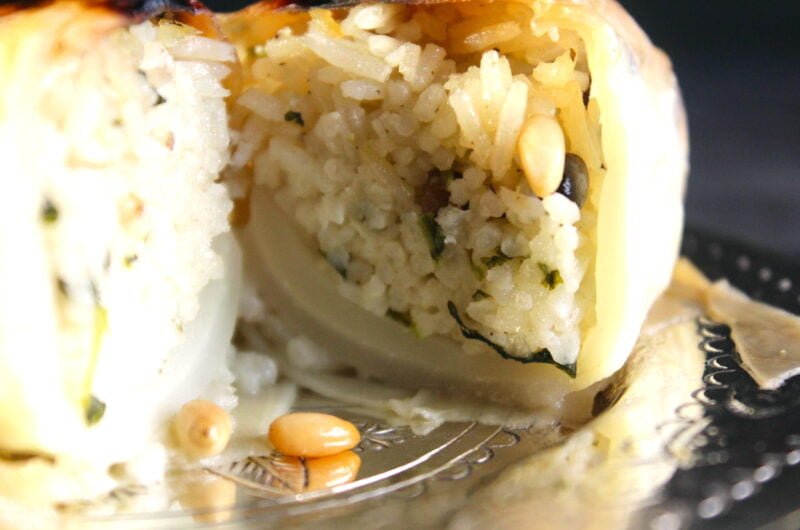 Creamy spicy rice in white cabbage leaf