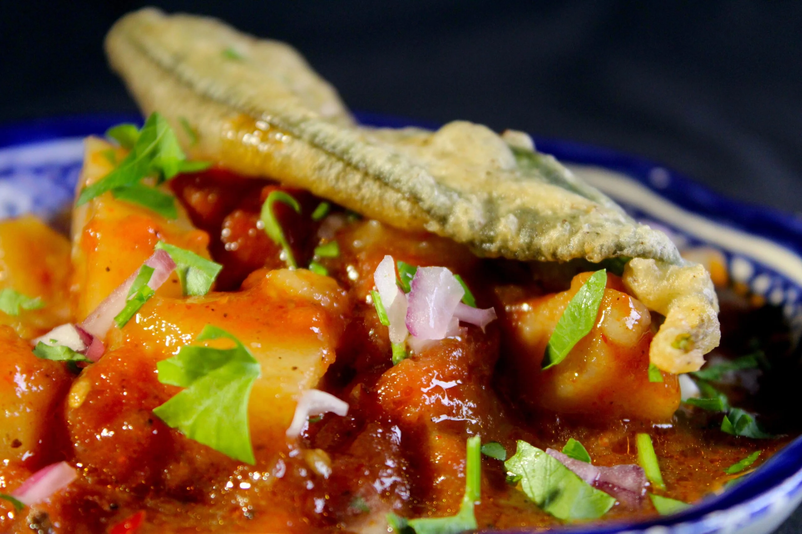 Slightly spicy potato-tomato salad with fried sage