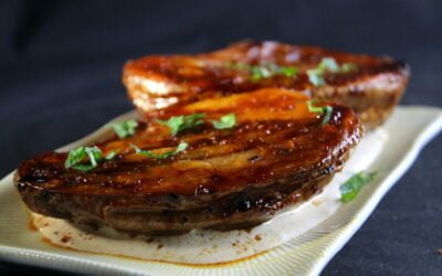 Glazed baked potato from the oven in sweet soy sauce-harissa-tahina