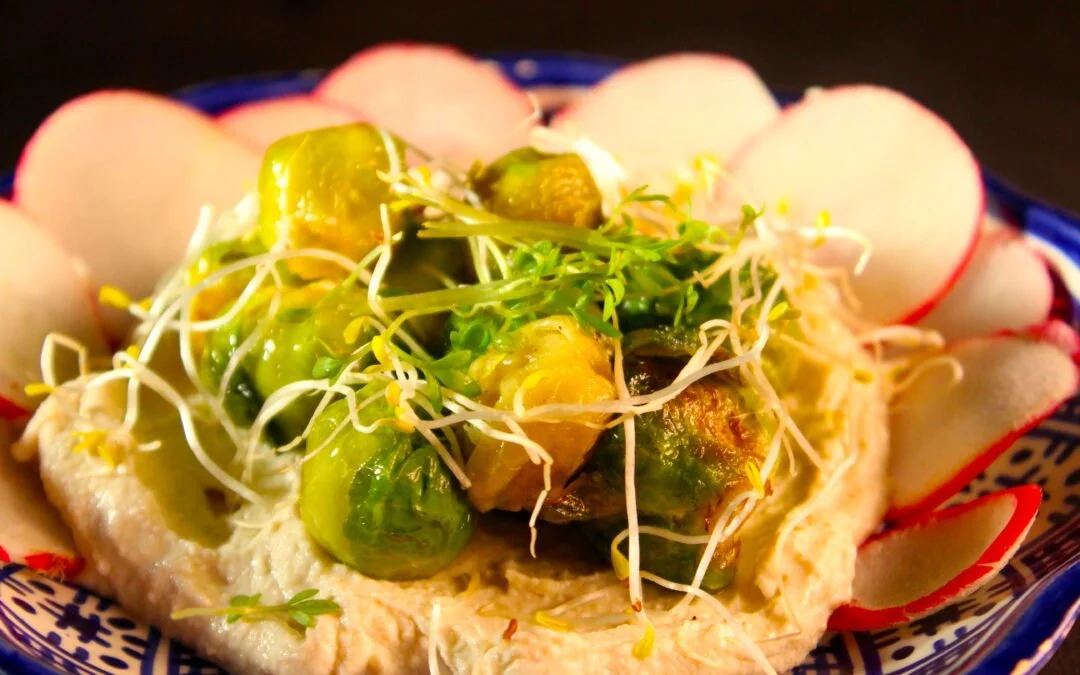 Brussels sprouts on a bed of cashew tahina sauce