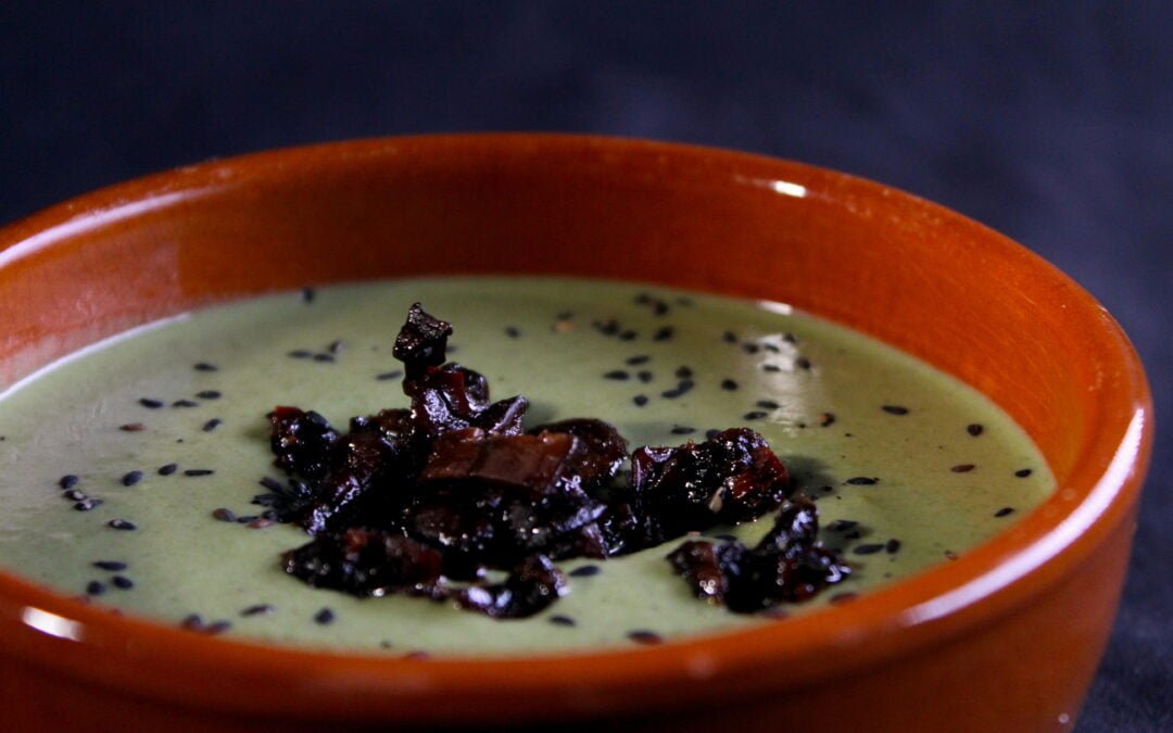 Spicy green soup with mushrooms in soy