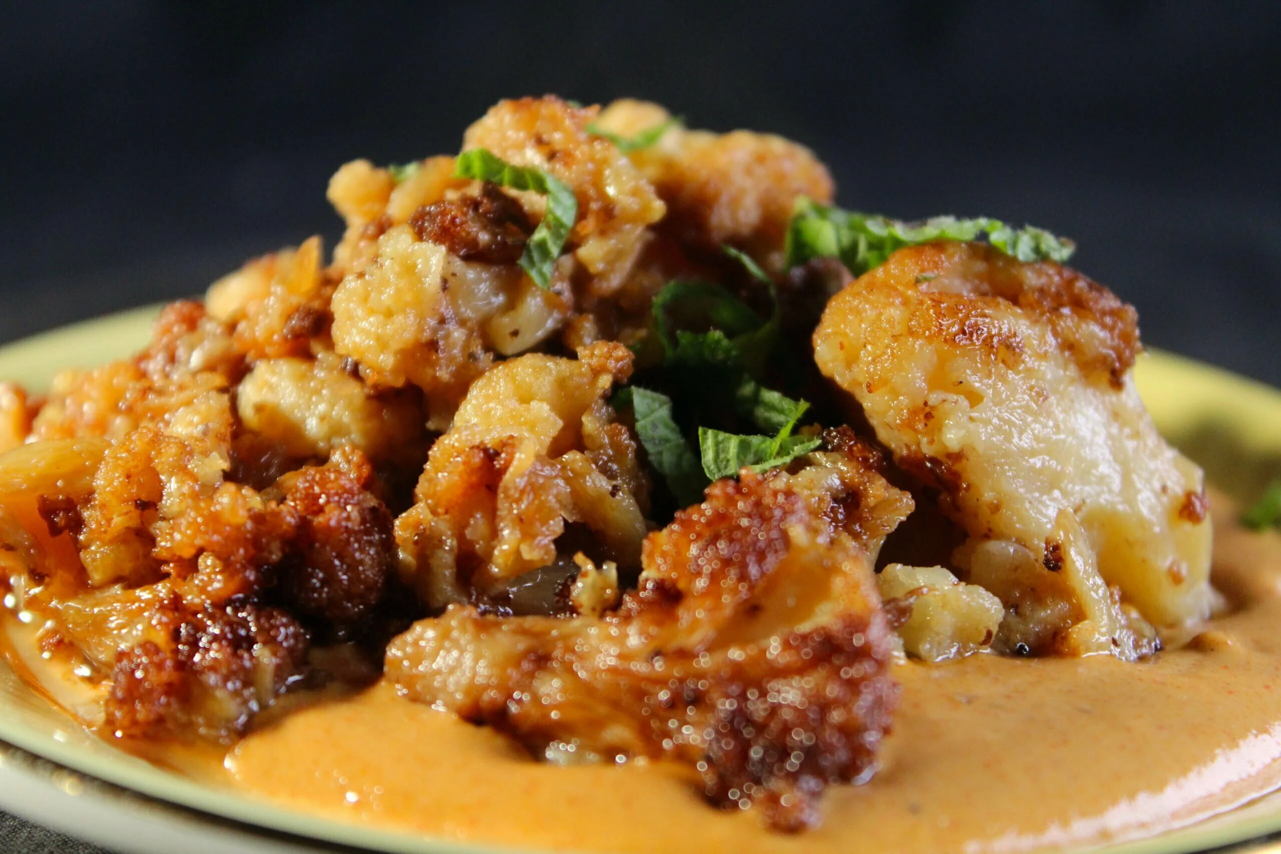 Deep fried cauliflower in tahina smoked paprika sauce