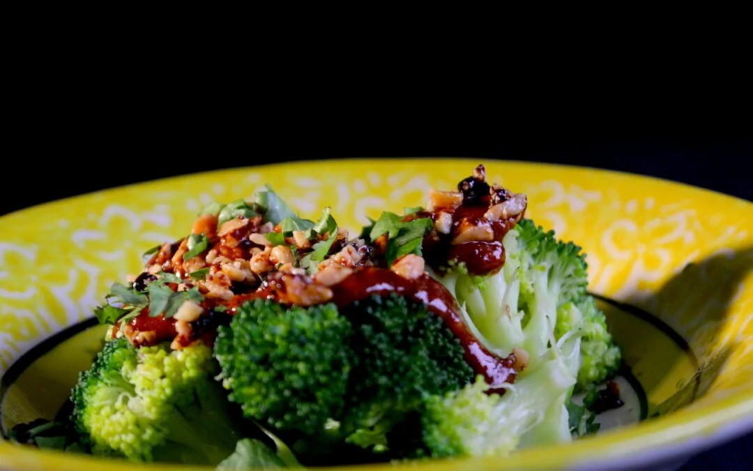 Broccoli with a slightly spicy gochujan sauce and caramelized peanuts