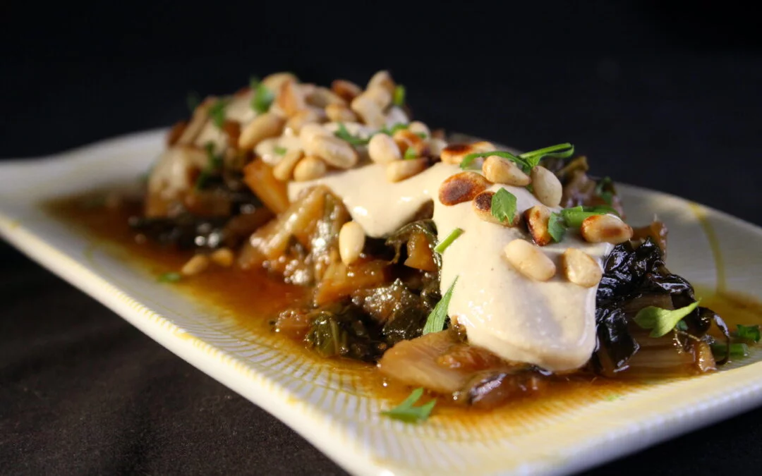 Swiss chard in white wine sauce with tahita sauce on top