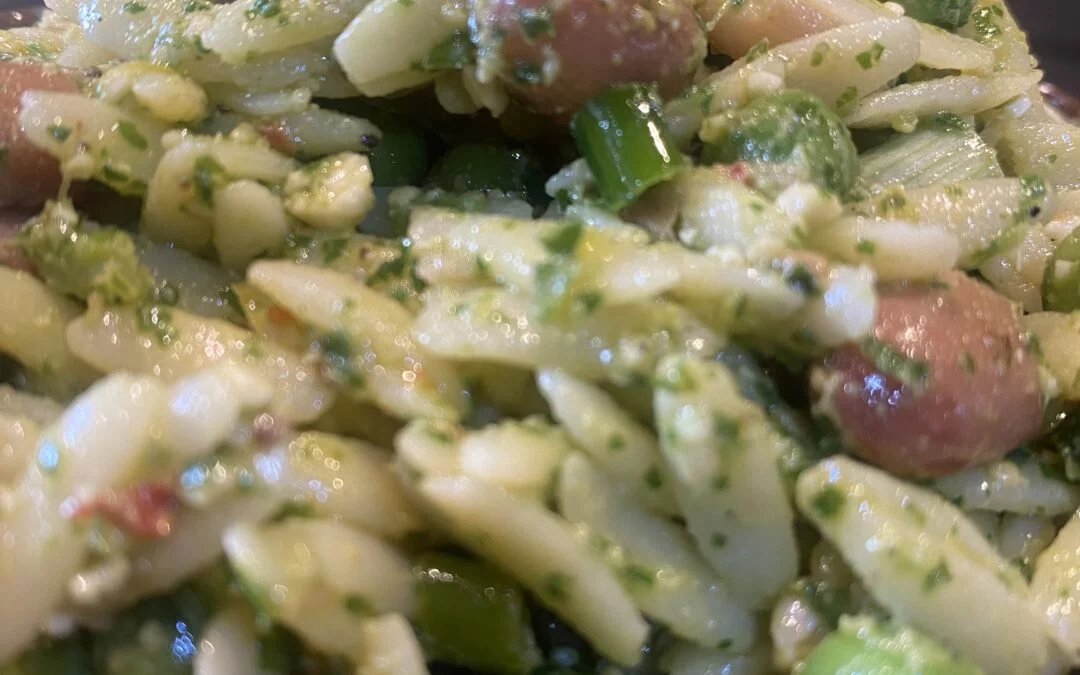 Orzo salad with borlotti beans, peas and arugula pesto