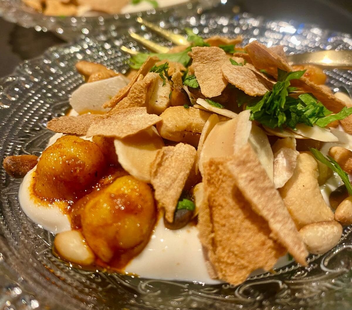 Fetteh with chickpeas, tahina yogurt and nuts