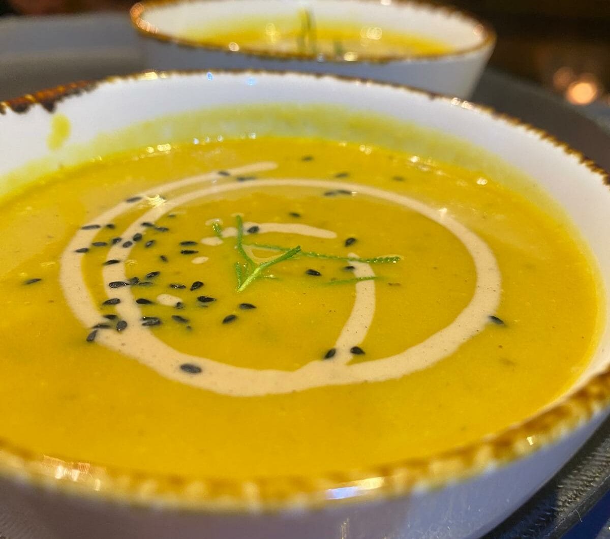 Grilled vegetable soup with fried lemon zest