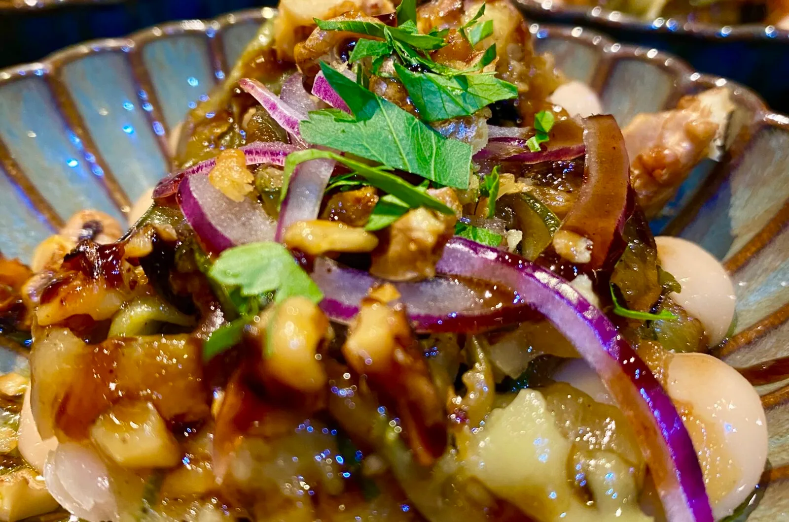 Salad of grilled zucchini strings, lima beans, walnut and pomegranate molasses